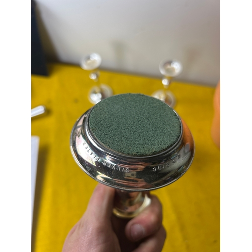 18 - 5 silver plate candle holders in good condition