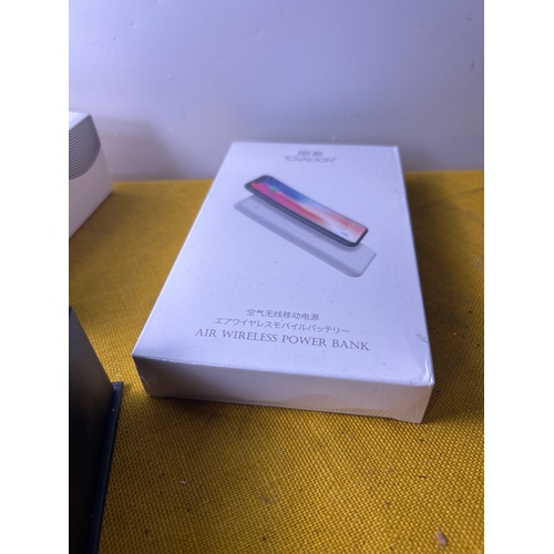 35 - Letscom wireless earbuds and a sealed wireless power bank