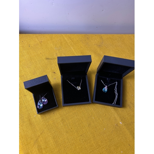 37 - 2 costume necklaces and pair of earrings - all boxed