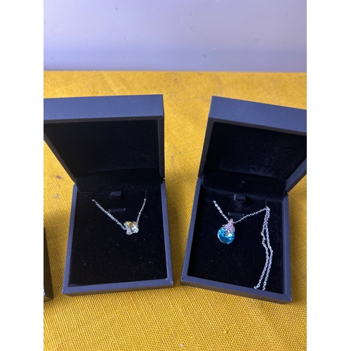37 - 2 costume necklaces and pair of earrings - all boxed