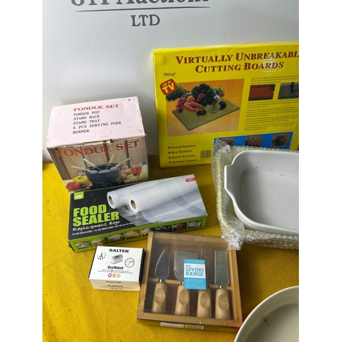 56 - Kitchen lot to inc mainly unused roasting dishes, cheese knives, fondue pot and more