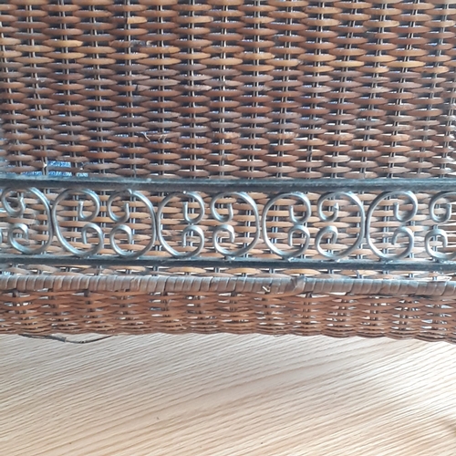 3 - Cast iron and wicker magazine rack