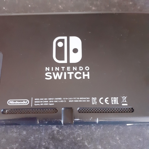 25 - Nintendo Switch - holds chargers, all buttons work as normal, seems to function - console only