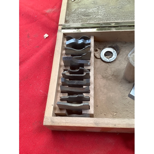 32 - Two boxes containing a set of moulder cutters and heavy duty carbide-tipped shaper cutters