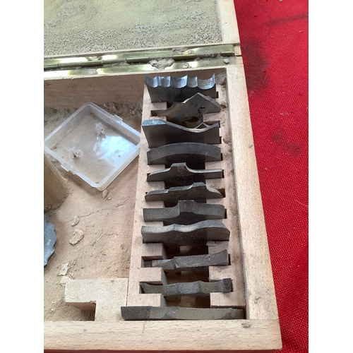 32 - Two boxes containing a set of moulder cutters and heavy duty carbide-tipped shaper cutters