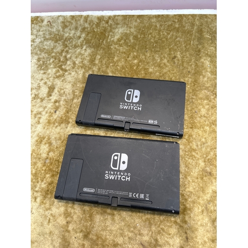 29 - Pair of Nintendo switch handheld consoles - HAC-001 - damaged charger port
