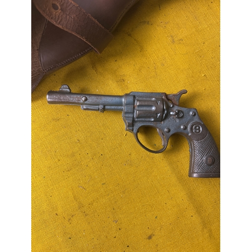 Metal diecast Smithson style gun with leather holster