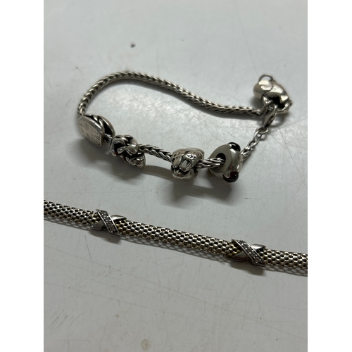 Pair of sterling silver bracelets and charm bracelet - 35.6g total weight