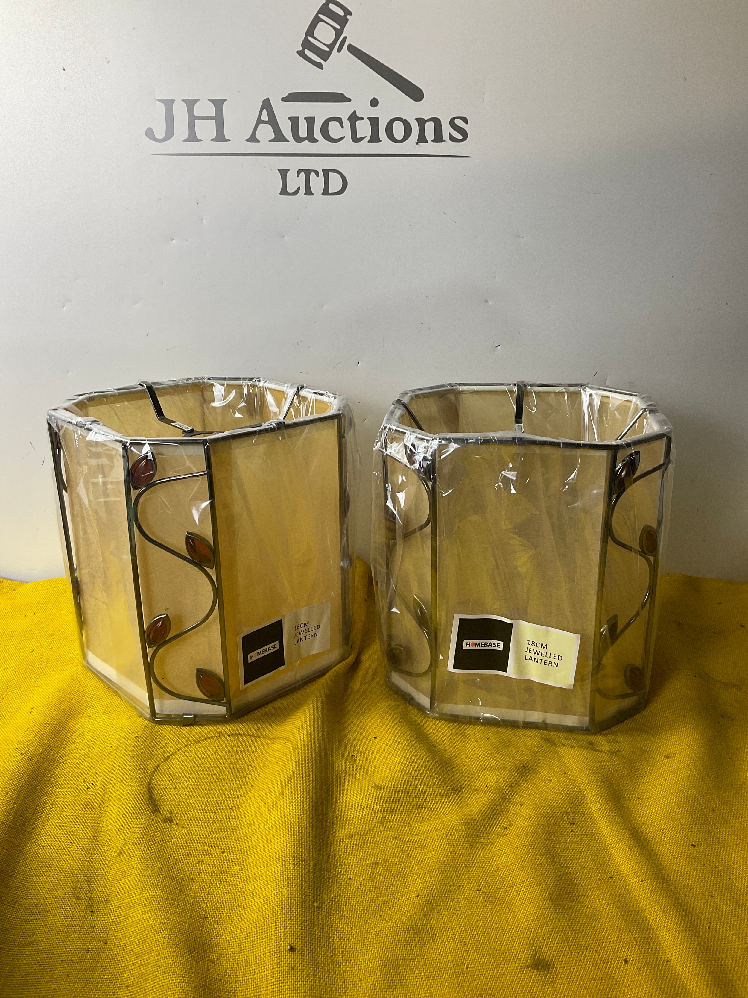 A pair of Homebase 18 cm Jewelled Lantern light shades