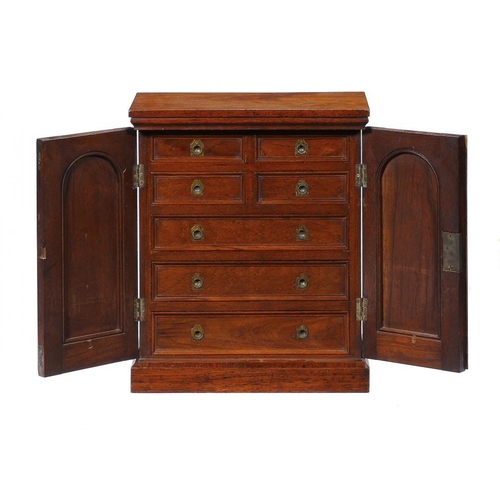 1380 - A VICTORIAN OAK COLLECTOR'S CABINET  fitted with four short and three long moulded, graduated drawer... 