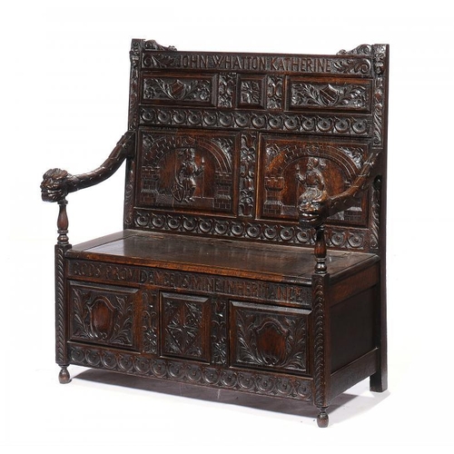 1394 - A CARVED OAK SETTLE, C1900  the back inscribed John Whatton/Katherine, box seat, 119cm h, 107cm w... 