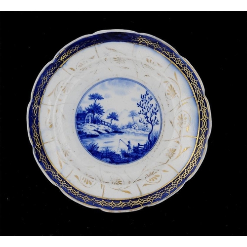 61 - A CAUGHLEY BLUE AND GILT BRIGHT LANDSCAPE PLATE, C1788-92  22.5cm diam, impressed SalopianLiterature... 