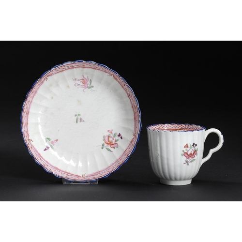 70 - A CAUGHLEY POLYCHROME REEDED AND FLUTED COFFEE CUP AND SAUCER, C1792-95  enamelled with the Honeysuc... 