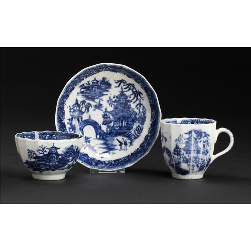 93 - A CALCUT BLUE AND WHITE FLUTED TRIO, C1794-96  printed with the Round Arched Bridge pattern, saucer ... 