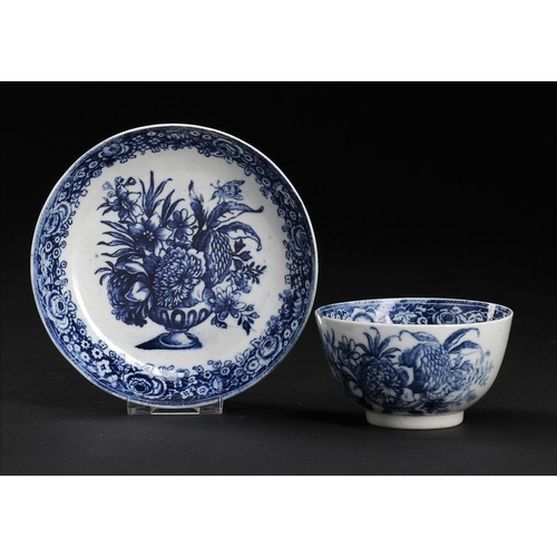 96 - A CALCUT BLUE AND WHITE TEA BOWL AND MATCHED SAUCER, C1794-96  printed with the Vase of Flowers patt... 