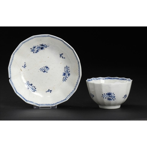 98 - A CALCUT BLUE AND WHITE FLUTED TEA BOWL AND SAUCER, C1794-96  painted with the Locre Sprigs pattern,... 