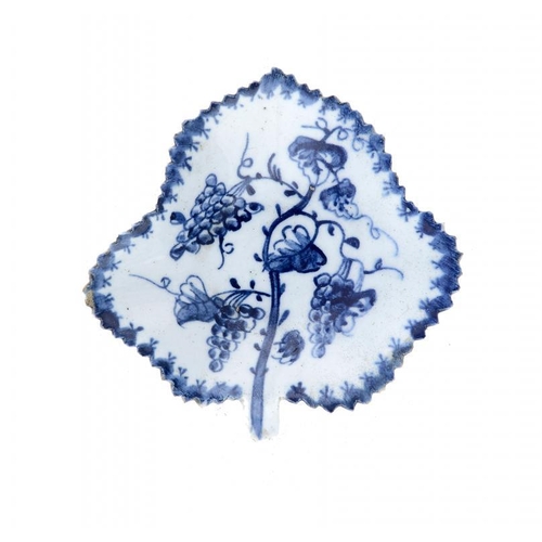 182 - A LOWESTOFT BLUE AND WHITE LEAF SHAPED PICKLE DISH, C1765-70 painted with fruiting vines in berry bo... 