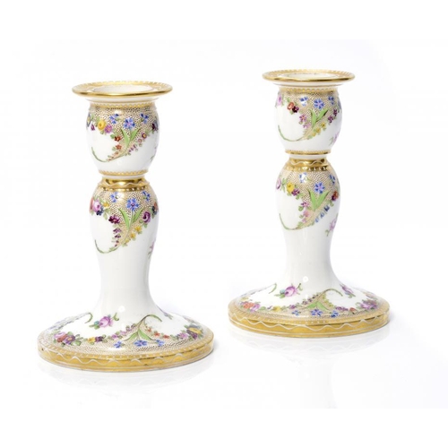 217 - A PAIR OF COALPORT BOUDOIR CANDLESTICKS, C1870 painted with flowers and finely gilt seeding, 13cm h ... 