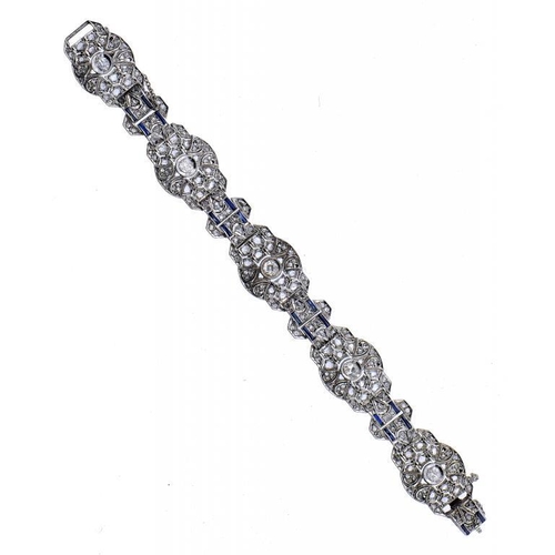 473 - AN ART DECO DIAMOND BRACELET, C1930 each link with larger colleted round   brilliant diamonDs and sy... 