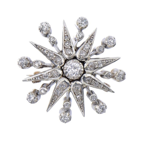 477 - A DIAMOND STAR BROOCH  30mm,  10g gross