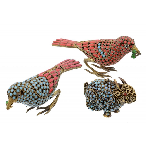 484 - TWO FILIGREE GILTMETAL AND STONE SET MODELS OF BIRDS AND A SIMILAR RABBIT,   SECOND QUARTER 20TH C b... 