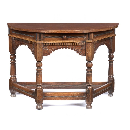 1012 - AN OAK CREDENCE TABLE IN JAMES I STYLE, 19TH/EARLY 20TH C with chip carved frieze and ebonised mould... 