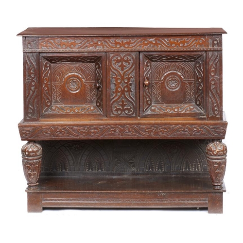 1013 - A CHARLES II OAK CUPBOARD, LATE 17TH C AND LATER   with pair of carved, recessed panel doors framed ... 