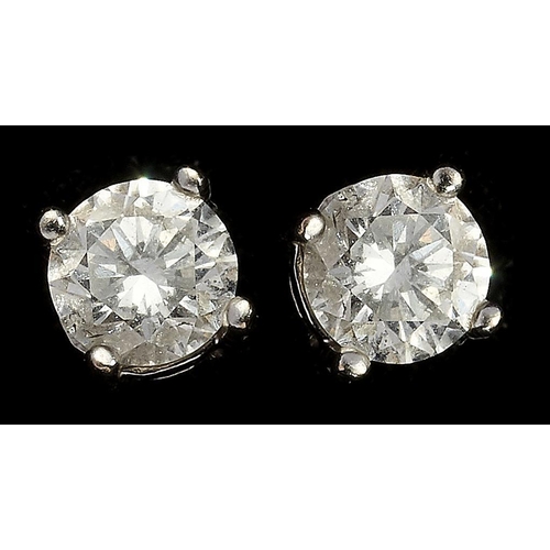 105 - A PAIR OF DIAMOND EAR STUDS set with round brilliant cut diamonds weighing approx 0.5ct each, mounte... 