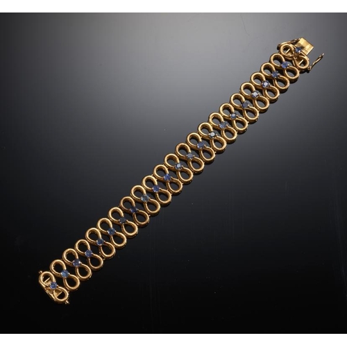 79 - A SAPPHIRE BRACELET in gold, 85mm, marked K18, indistinct signature, 48.7g