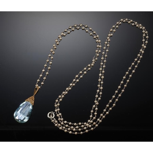 80 - A FINE AQUAMARINE PENDANT AND CULTURED PEARL CHAIN the briolette aquamarine 36 x 20mm, gold filigree... 