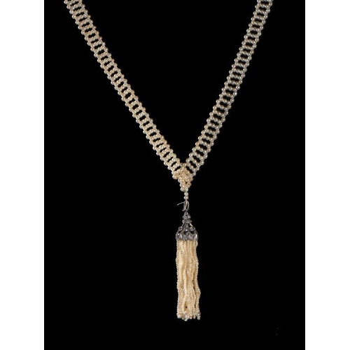 85 - A PEARL AND DIAMOND SAUTOIR, EARLY 20TH C the tassel in white gold, 60cm, unmarked, 39.5g... 