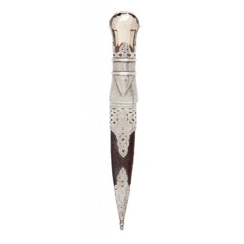 890 - A SCOTTISH SILVER MOUNTED SGAIN-DUBH AND SHEATH, C1900  with faceted citrine pommel, the blade with ... 