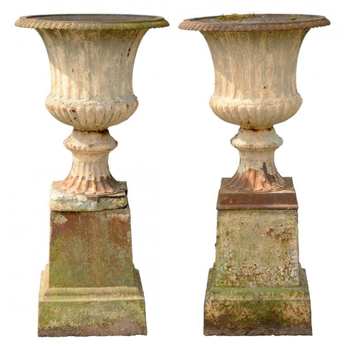 930 - A PAIR OF VICTORIAN CAST IRON GARDEN VASES AND PEDESTALS, LATE 19TH C  130cm h