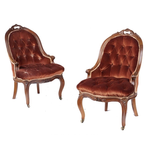 964 - A PAIR OF VICTORIAN CARVED WALNUT SPOON BACK CHAIRS, C1870 in later buttoned red velvet upholstery, ... 