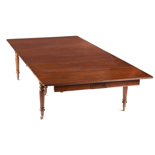 988 - A GEORGE IV MAHOGANY DINING TABLE IN THE MANNER OF GILLOWS, C1820  on reeded tapering legs, 73cm h ;... 