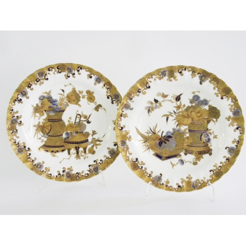 156 - A PAIR OF CROWN DERBY FLUTED PLATES, DECORATED IN TONES OF BLUE AND RAISED, COLOURED GILDING, WITH F... 