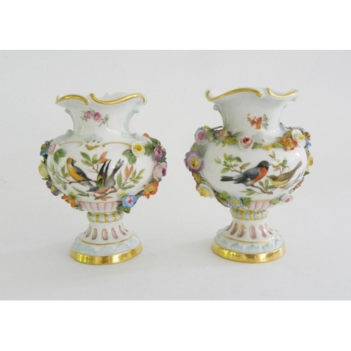 201 - A PAIR OF MEISSEN FLORAL ENCRUSTED OGEE VASES, PAINTED TO EITHER SIDE WITH BIRDS ON A BRANCH OR FLOW... 