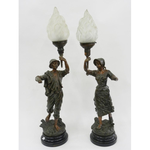 241 - A PAIR OF FRENCH FIN DE SIECLE RUSTIC FIGURAL LAMPS, EACH HOLDING A TORCH WITH FROSTED GLASS FLAMBEA... 