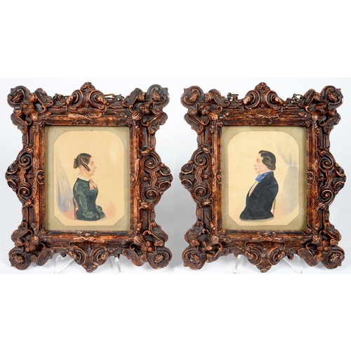 250 - ENGLISH NAIVE ARTIST, 19TH C - PORTRAIT MINIATURES OF A LADY AND GENTLEMAN, HALF LENGTH, SEATED IN P... 