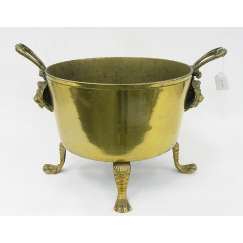 259A - A BRASS COAL BUCKET WITH LION MASK HANDLES AND PAW FEET, 28CM H, 35CM D