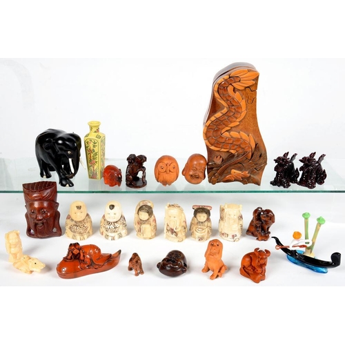 284 - A SMALL COLLECTION OF SOUTH EAST ASIAN MINIATURE WOOD, AMBER AND OTHER CARVINGS, ETC