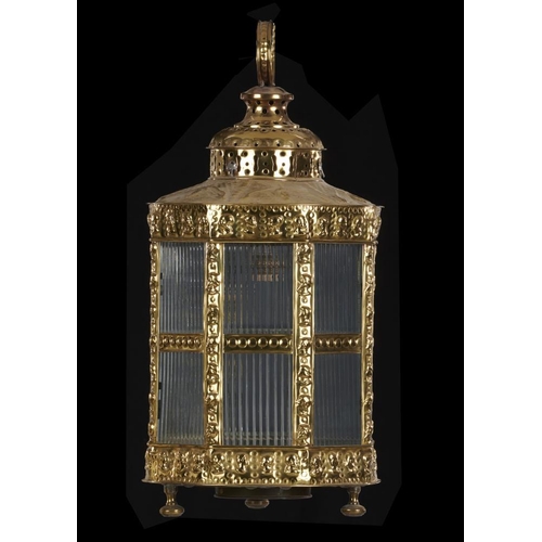 327 - A DUTCH OCTAGONAL EMBOSSED SHEET BRASS HANGING LANTERN, EARLY 20TH C, 63cm h, later electric fitment... 