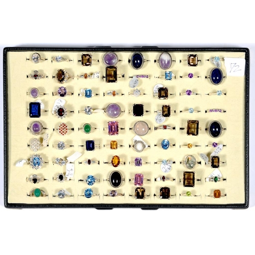 63 - SEVENTY TWO SILVER RINGS SET WITH SYNTHETIC STONES