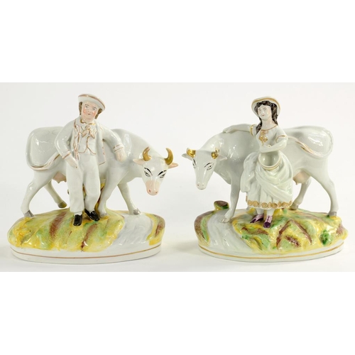 124 - A PAIR OF STAFFORDSHIRE EARTHENWARE FIGURES OF A FARMER AND WIFE WITH A COW, 21CM H, MID 19TH C... 