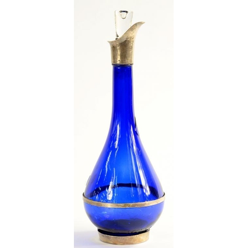 161A - A SILVER MOUNTED BLUE GLASS DECANTER AND STOPPER, 32CM H