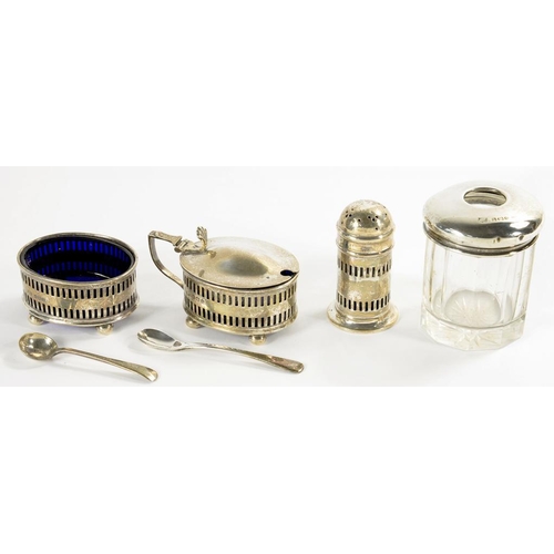 91A - A GEORGE V PIERCED SILVER THREE PIECE CONDIMENT SET, BLUE GLASS LINERS, MUSTARD POT, 4CM H, BIRMINGH... 