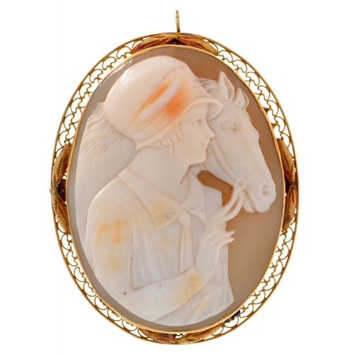 102 - A SHELL CAMEO BROOCH OF A HORSE AND RIDER, IN GOLD, UNMARKED, 4.5 X 3.5 CM APPROX