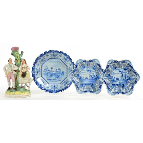 315 - ONE AND A PAIR OF DEFLT DISHES AND A LATE VICTORIAN STAFFORDSHIRE GROUP OF LOVERS