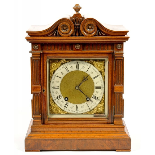 336 - A GERMAN WALNUT AND BURR WALNUT ARCHITECTURAL CASED MANTEL CLOCK WITH CARVED PEDIMENT, FLUTED PILAST... 