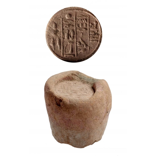 382 - ANTIQUITIES.  A 19th / 20th century reproduction of aN EGYPTIAN FUNERARY CONE, of reddish clay, with... 